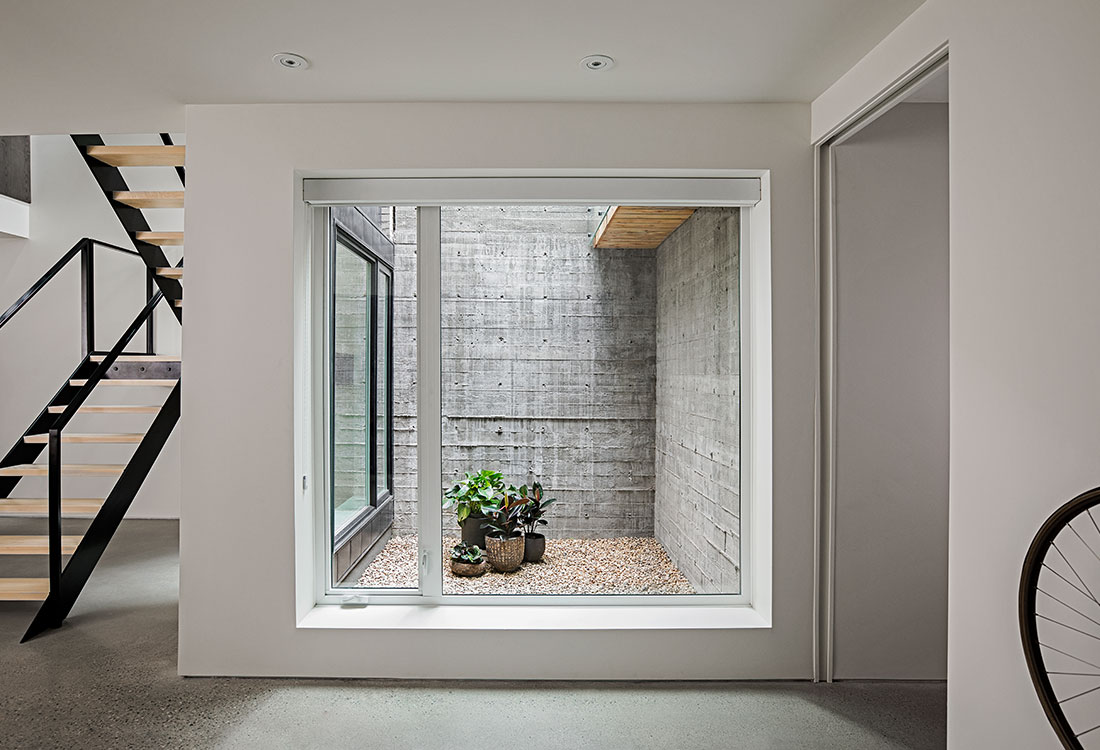 The Light House — masonry custom home designed for natural light by Anonymous Architecture Calgary
